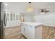 Open concept kitchen with an island and stainless steel appliances, next to additional cabinet space at 206 N Beverly Ave # 1/2, Tampa, FL 33609
