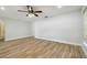 Living room featuring neutral paint and wood-look tile flooring at 206 N Beverly Ave # 1/2, Tampa, FL 33609