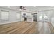 Open concept living room and kitchen with stainless steel appliances and wood floors at 206 N Beverly Ave # 1/2, Tampa, FL 33609