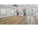Open concept living room and kitchen with stainless steel appliances and wood floors at 206 N Beverly Ave # 1/2, Tampa, FL 33609