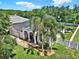 An aerial view of a charming single-story home with a well-manicured lawn and fenced in yard at 20835 Lake Talia Blvd, Land O Lakes, FL 34638