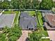 Aerial view of a beautiful home featuring brick driveway and lush landscaping and a fenced backyard at 20835 Lake Talia Blvd, Land O Lakes, FL 34638