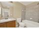 Cozy bathroom with tiled shower over tub, tile flooring and a single sink vanity at 20835 Lake Talia Blvd, Land O Lakes, FL 34638