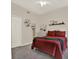 Cozy bedroom showcasing carpet floors, double door closet, and a comfortable double bed with dresser at 20835 Lake Talia Blvd, Land O Lakes, FL 34638