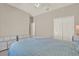 Spacious bedroom with carpet, a double bed, dressers and a double-door closet at 20835 Lake Talia Blvd, Land O Lakes, FL 34638