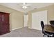 This bedroom features neutral walls, gray carpet, a ceiling fan and a large double door closet at 20835 Lake Talia Blvd, Land O Lakes, FL 34638
