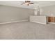 Open bonus room featuring neutral walls and gray carpet, creating a versatile living space at 20835 Lake Talia Blvd, Land O Lakes, FL 34638