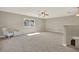An expansive bonus room with neutral walls, gray carpet and a ceiling fan at 20835 Lake Talia Blvd, Land O Lakes, FL 34638