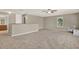 Open bonus room featuring neutral walls and gray carpet, creating a versatile living space at 20835 Lake Talia Blvd, Land O Lakes, FL 34638