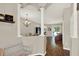 Bright dining room with chandelier, columns, hardwood floors, and sliding glass doors at 20835 Lake Talia Blvd, Land O Lakes, FL 34638