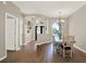 Elegant dining room featuring hardwood floors and a charming chandelier lighting the space at 20835 Lake Talia Blvd, Land O Lakes, FL 34638