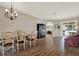 Spacious dining room with hardwood floors, a chandelier, and plenty of natural light at 20835 Lake Talia Blvd, Land O Lakes, FL 34638