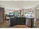 Open-concept kitchen with a peninsula featuring stainless steel dishwasher and sink plus dining area at 20835 Lake Talia Blvd, Land O Lakes, FL 34638