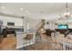 Open kitchen featuring stainless steel appliances, granite countertops, an island with seating, and hardwood floors at 20835 Lake Talia Blvd, Land O Lakes, FL 34638