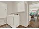 Bright laundry room featuring side by side washing machine and dryer, and neutral walls at 20835 Lake Talia Blvd, Land O Lakes, FL 34638