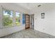 Sunroom features large windows, bright light, and tile floors at 217 W Powhatan Ave, Tampa, FL 33604