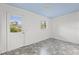 Room with custom tile floor, blue ceiling, and backyard access at 217 W Powhatan Ave, Tampa, FL 33604