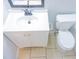 A white vanity and toilet stand on the bathroom's tiled floor at 220 Berry Tree Pl # 220, Brandon, FL 33510