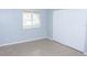 Bedroom with neutral tiled flooring, closet, and window at 220 Berry Tree Pl # 220, Brandon, FL 33510