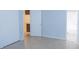 Bedroom with views to the kitchen and bathroom, and neutral tiled flooring at 220 Berry Tree Pl # 220, Brandon, FL 33510