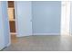 Bedroom with views to the kitchen and bathroom, and neutral tiled flooring at 220 Berry Tree Pl # 220, Brandon, FL 33510