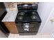 A modern black oven with an electric cooktop stands next to gray and white countertops at 220 Berry Tree Pl # 220, Brandon, FL 33510