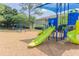 Community playground featuring modern, colorful play equipment with slides, swings, and a shaded play area at 220 Berry Tree Pl # 220, Brandon, FL 33510