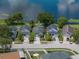 Lovely aerial view of home situated next to a tranquil lake, showcasing the surrounding greenery at 22829 Saint Thomas Cir, Lutz, FL 33549
