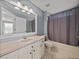 Bathroom with stylish vanity and shower-tub combo at 22829 Saint Thomas Cir, Lutz, FL 33549