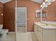 En Suite bathroom with vanity and connecting door to a bedroom at 22829 Saint Thomas Cir, Lutz, FL 33549