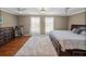 Spacious bedroom boasts wood floors, a plush rug, and lots of natural light at 22829 Saint Thomas Cir, Lutz, FL 33549