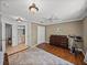 Bright bedroom boasts wood floors, a plush rug, and lots of natural light at 22829 Saint Thomas Cir, Lutz, FL 33549