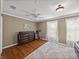 Bright bedroom boasts wood floors, a plush rug, and lots of natural light at 22829 Saint Thomas Cir, Lutz, FL 33549