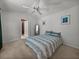 Bedroom with closet and bed with blue patterns at 22829 Saint Thomas Cir, Lutz, FL 33549