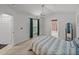 Bedroom with closet and bed with blue patterns at 22829 Saint Thomas Cir, Lutz, FL 33549