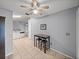 Dining area adjacent to the kitchen featuring bar table, breakfast stools, and tile floors at 22829 Saint Thomas Cir, Lutz, FL 33549