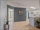 Open floor plan with tile floors leading to kitchen and second living area at 22829 Saint Thomas Cir, Lutz, FL 33549