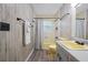 Bathroom with unique vanity, yellow toilet and shower/tub combo at 2308 Cape Bend Ave, Tampa, FL 33613