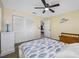 Bright bedroom features wood look floors, double closets, and a ceiling fan at 2308 Cape Bend Ave, Tampa, FL 33613