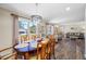 Open-concept dining room with a large window and view of the front yard at 2308 Cape Bend Ave, Tampa, FL 33613