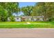 Inviting single-story home featuring a well-maintained lawn and charming curb appeal at 2308 Cape Bend Ave, Tampa, FL 33613