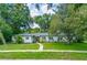 Inviting single-story home featuring a well-maintained lawn and charming curb appeal at 2308 Cape Bend Ave, Tampa, FL 33613