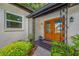 Charming front entry with a double door, tile entry, and black iron details at 2308 Cape Bend Ave, Tampa, FL 33613