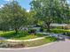 Charming home featuring lush landscaping, mature trees, and a well-maintained lawn at 2308 Cape Bend Ave, Tampa, FL 33613