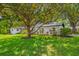 Charming single-story home with well-manicured lawn and mature trees providing ample shade at 2308 Cape Bend Ave, Tampa, FL 33613