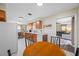 Bright eat-in kitchen with stainless steel appliances and a view into the living room at 2308 Cape Bend Ave, Tampa, FL 33613