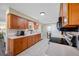 Updated kitchen featuring sleek appliances, ample cabinet space, and tile flooring at 2308 Cape Bend Ave, Tampa, FL 33613