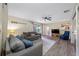 Comfortable living room with hardwood floors, neutral paint, sofas, TV, and natural light at 2308 Cape Bend Ave, Tampa, FL 33613
