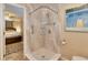 Tiled shower with shelves and safety bar adjacent to bedroom at 2848 Homewood St, Clearwater, FL 33759