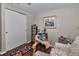 Bedroom with wood floors, closet, and seating area at 2848 Homewood St, Clearwater, FL 33759